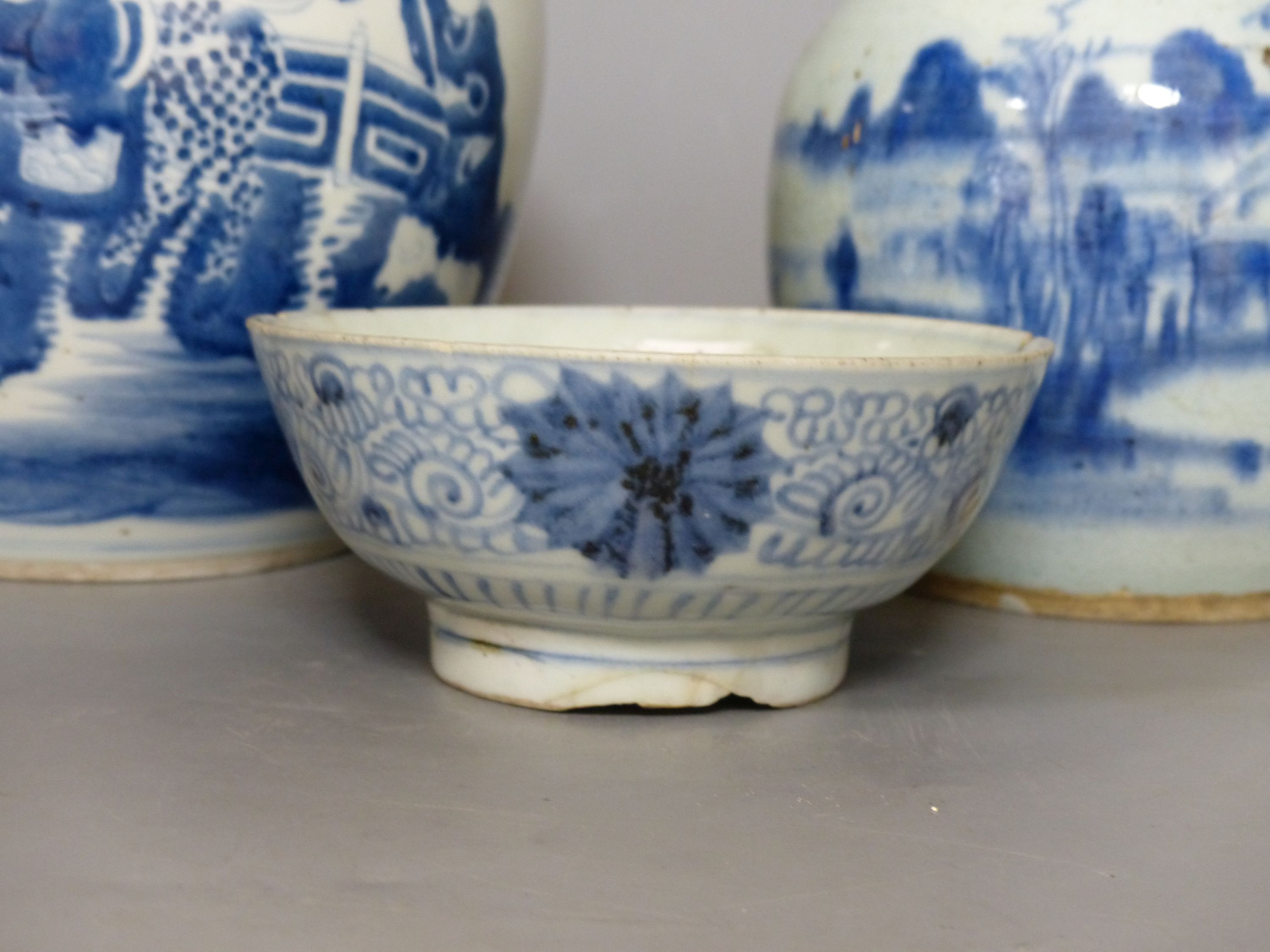 A Chinese blue and white jar, a smaller jar and a bowl, tallest 21cm